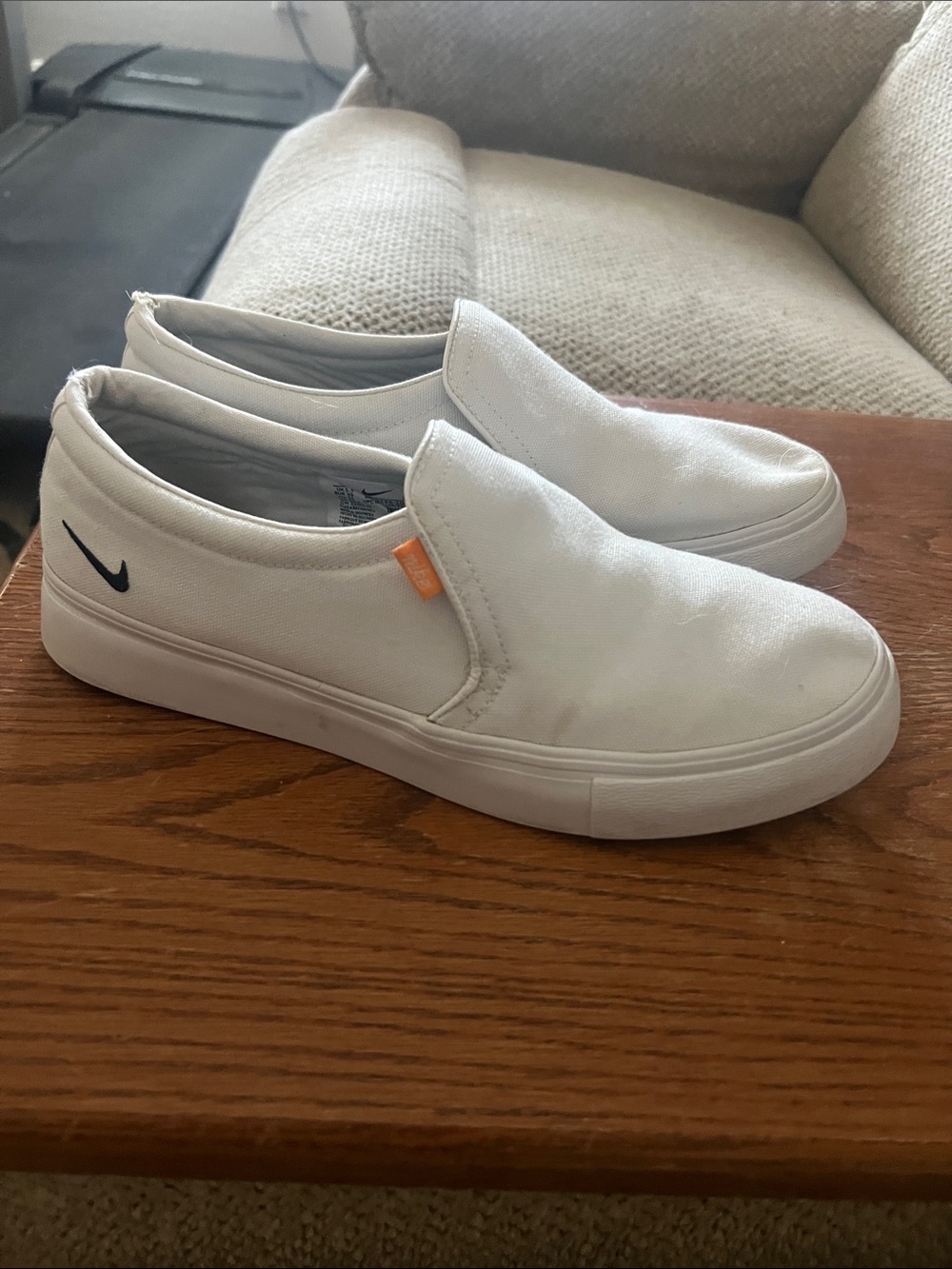 Nike Women’s White Slip-On Canvas Loafers with Black Swoosh